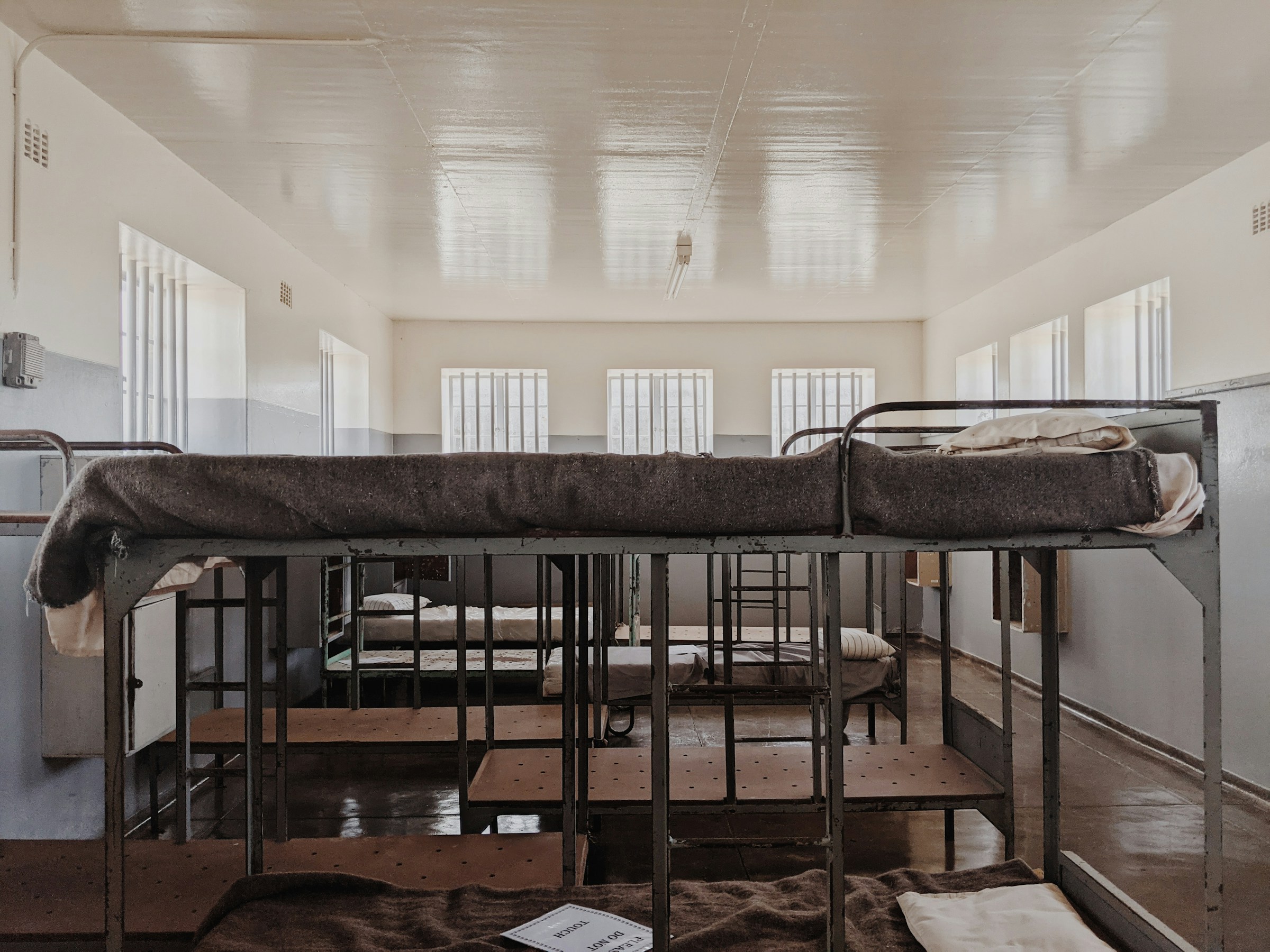 Prison cell interior with simple bunks, Section B, Robben Island